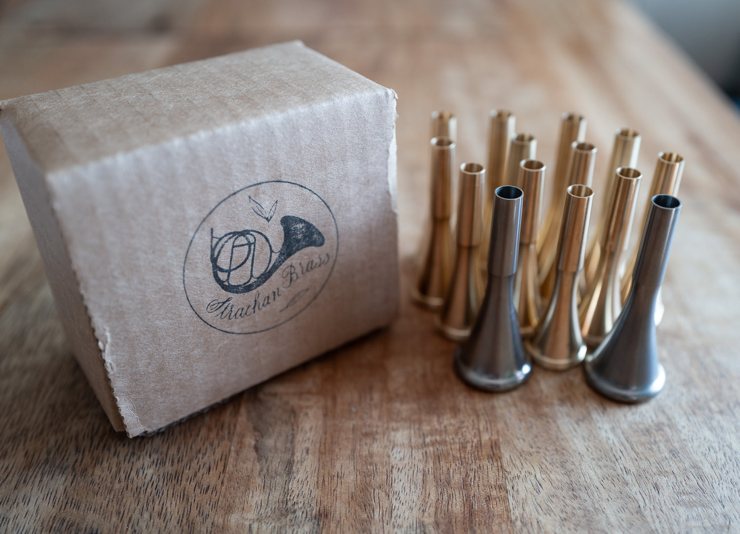 A Strachan Brass Shipping Box and a dozen mouthpieces